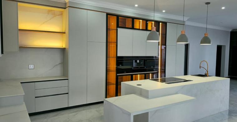 Velora kitchen — pendants and warm cabinetry